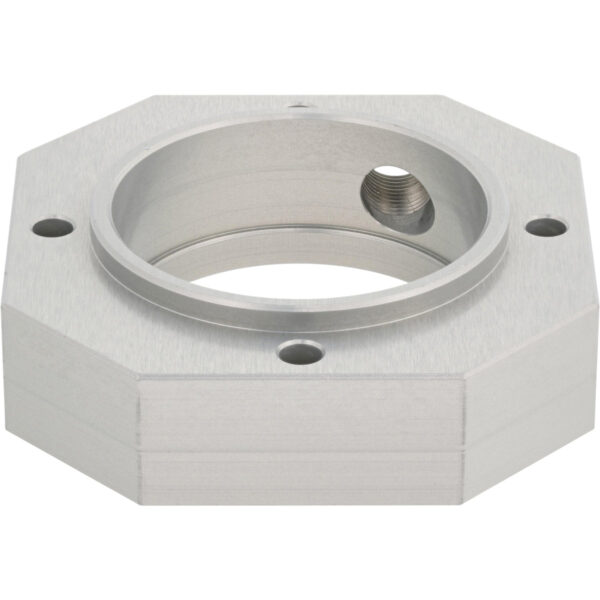 Octagonal part made of aluminum with a large center hole and four smaller through-holes on the top surface. The part is on a white background.