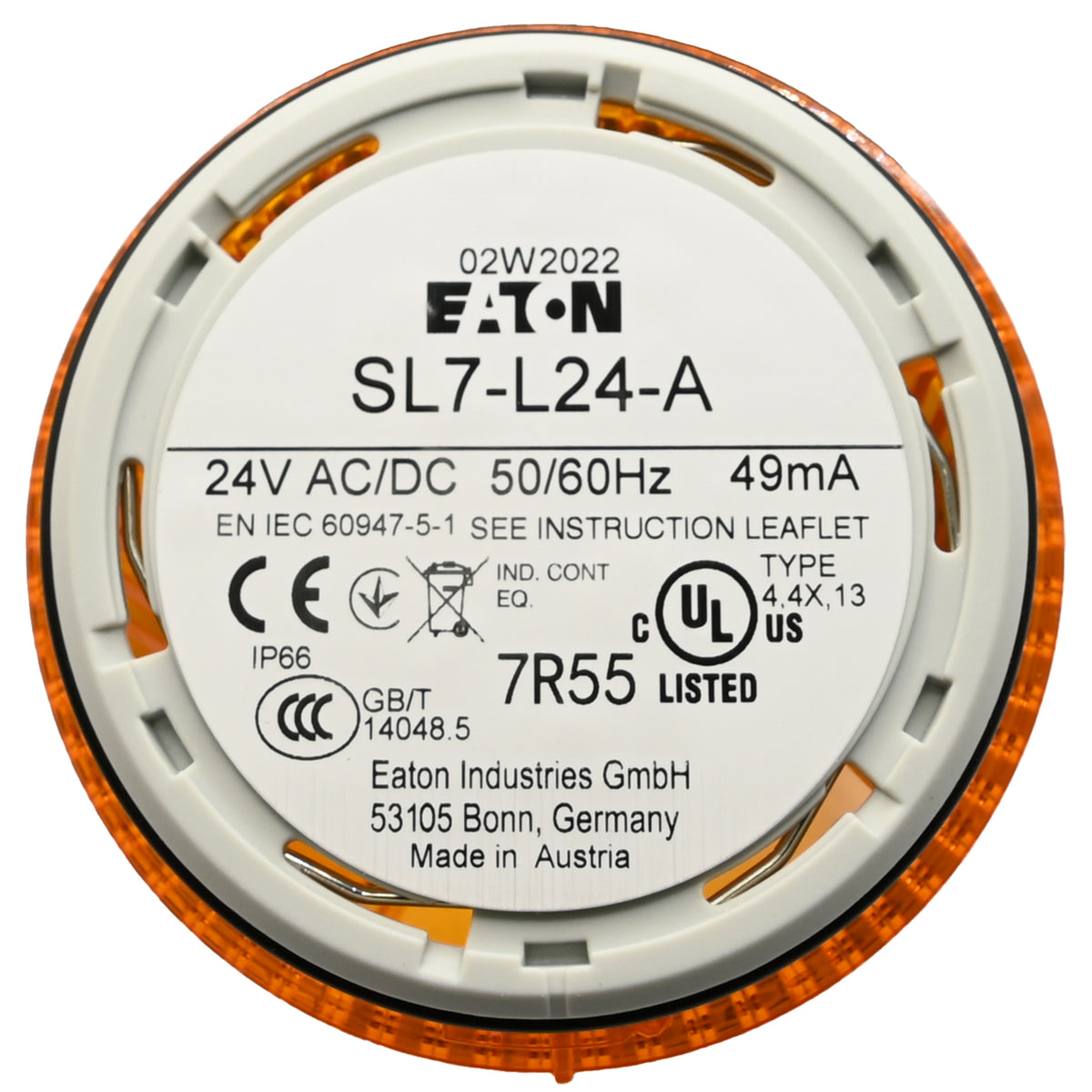 White product label with black text on underside of cylindrical amber stack light on white background.