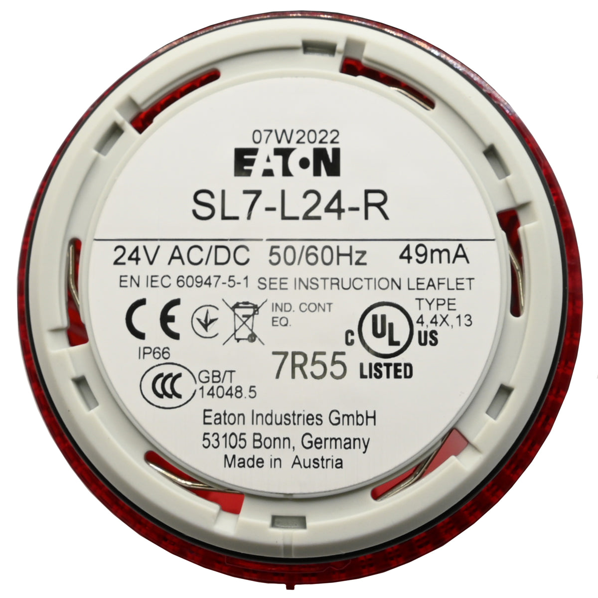 White product label with black text on underside of cylindrical red stack light on white background.