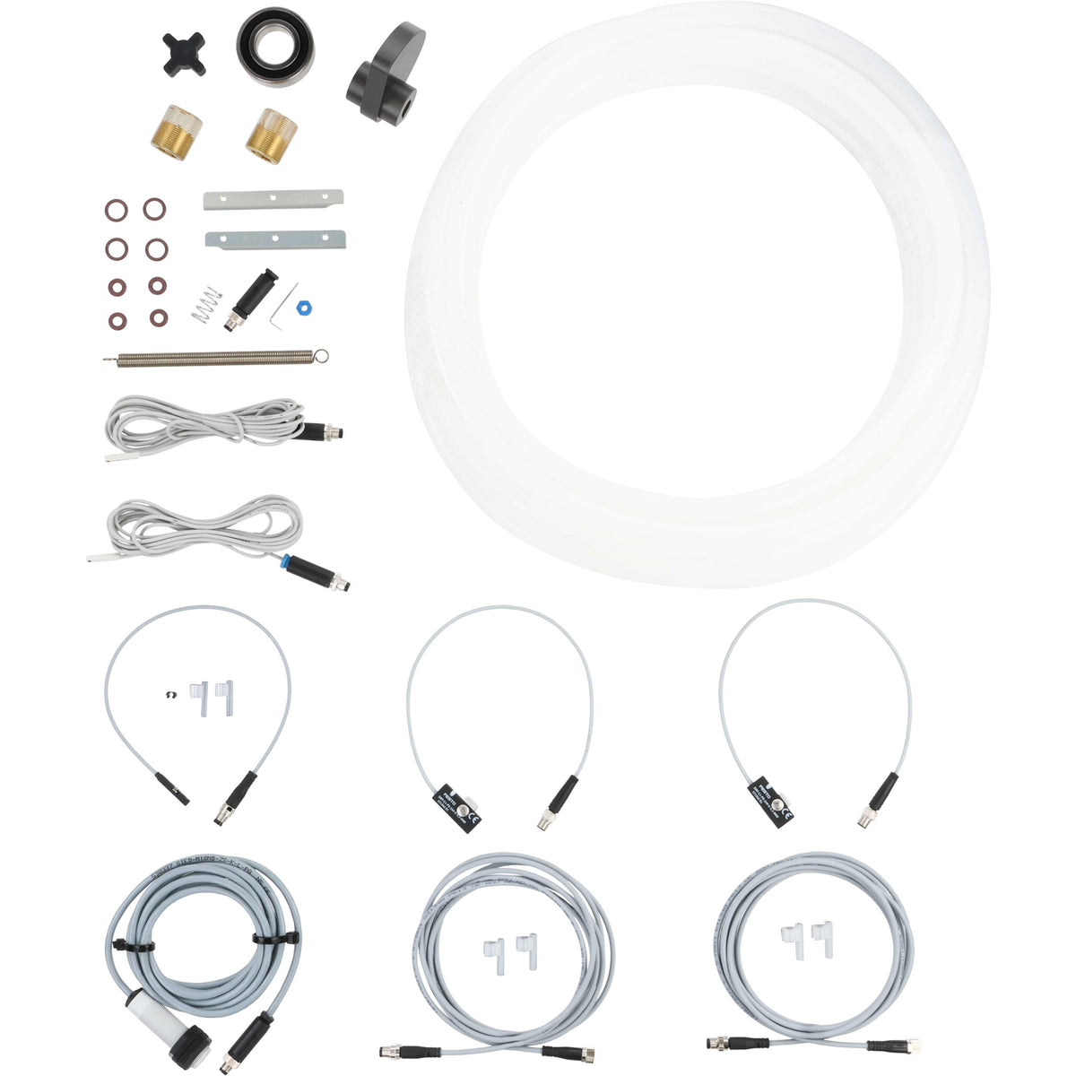 An assortment of parts that include sensor cables, o-rings, product tubing, springs, bearings and a rotary cam. Parts shown on a white background.